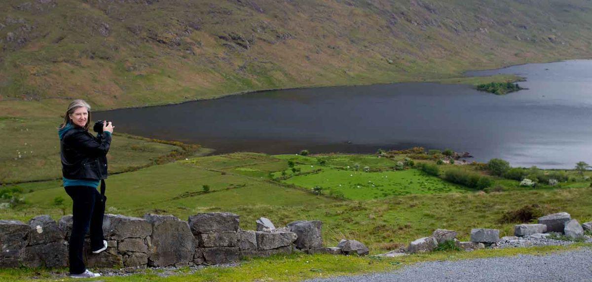 Photographer at work at Lough Nafooey in Connemara, Ireland